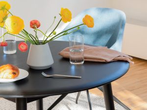corner-of-round-black-dinette-table-blue-chair_ORIGINAL